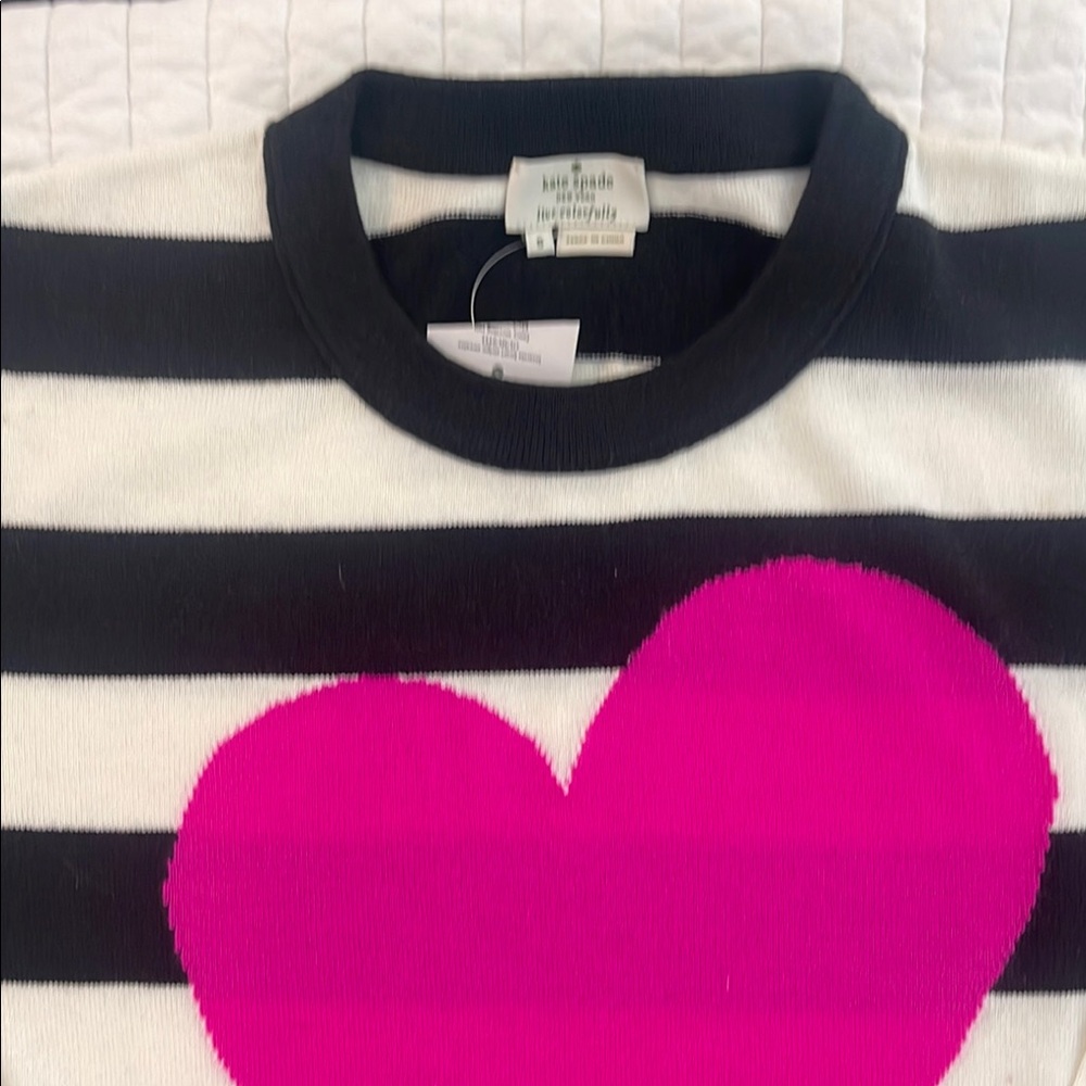 Kate Spade sweater, black, off white & pink.Runs large, new with tags